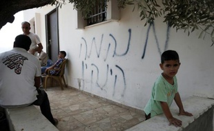 Le mur de cette maison palestinienne a reçu le 2 octobre 2015 un graffiti appelant à la "vengeance" après le meurtre d'un couple de colons