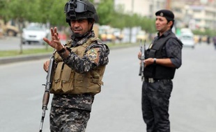 Des policiers à Bagdad, le 20 mai 2013