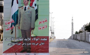 Une affiche électorale de Bachar al-Assad dans un quartier de Homs, le 12 mai 2014