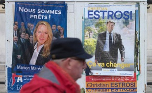 Les affiches de campagne des candidats aux régionales en Paca Marion Maréchal-Le Pen (FN, à g) et Christian Estrosi (LR, à d) à Marseille, le 7 décembre 2015