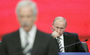 Russia's President Vladimir Putin (R) looks on as Duma speaker Boris Gryzlov addresses the congress of the main pro-Kremlin United Russia party in Moscow October 1, 2007. Putin also announced he would head the party's list for December's parliamentary elections, guaranteeing him a place in the Duma.