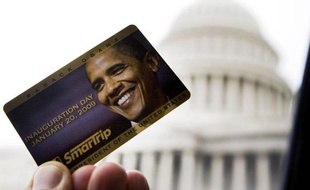 Commemorative Washington DC 'SmarTrip' Metro fare card with the image of U.S. President-elect Barack Obama's face is seen next to a bus window on the East side of the U.S. Capitol Building in Washington, January 13, 2009. The only other president to be honored this way on a Metro card was Bill Clinton in 1993. REUTERS/Larry Downing (UNITED STATES)