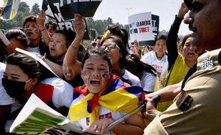 Des exilés tibétains lors d'une manifestation le 10 mars 2015 devant l'ambassade chinois à New Delhi pour commémorer le soulèvement de 1959 contre le pouvoir chinois