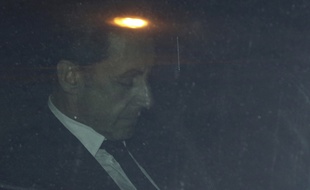Nicolas Sarkozy à sa sortie du pôle financier du TGI de Paris, le 1er juillet 2014, où il a été mis en examen pour corruption active et trafic d'influence.