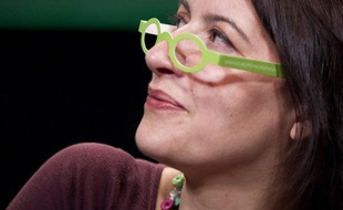 EELV national secretary Cecile Duflot wearing European Greens promotional cardboard glasses during the European Greens Congress on November 12, 2011 in Paris. AFP PHOTO JOEL SAGET