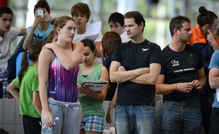 Camille Muffat au côté de Fabrice Pellerin en 2012.