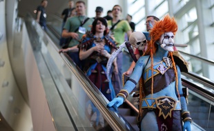 A woman dressed as Voljin from the video game World of Warcraft rides an escalator at the BlizzCon, Friday, Nov. 6, 2015, in Anaheim, Calif. "World of Warcraft" maker Blizzard is hosting its ninth annual fan-centric convention opening Friday. (AP Photo/Jae C. Hong)/CAJH118/449290986561/1511062253