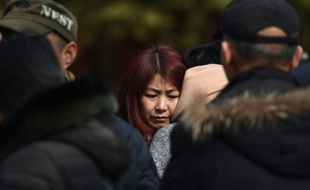 Des parents de passagers du vol MH370 de la Malaysia Airlines, disparu en vol, se retrouvent le 8 mars 2016 à Pékin pour le 2ème anniversaire de cette catastrophe aérienne qui reste un mystère