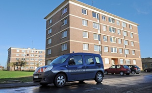 A gendarme's car passes in the "Grand Parc" quarter on March 2, 2015 in Landrecies, northern France, after a 8 years-old girl was killed and her father attempted to comit suicide. AFP PHOTO / FRANCOIS LO PRESTI