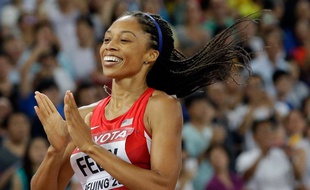 United States' Allyson Felix celebrates after winning the gold medal in the women's 400m final at the World Athletics Championships at the Bird's Nest stadium in Beijing, Thursday, Aug. 27, 2015. (AP Photo/Lee Jin-man) /WTC293/594268776311/1508271602