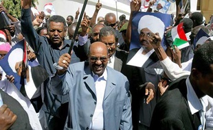 Sudanese President Omar al-Beshir attends a mass demonstration in Khartoum on March 5, 2009, in protest at the international arrest warrant issued against him for alleged war crimes in Darfur. Beshir, the first sitting head of state to be issued a warrant, dismissed the warrant and told the thousands of protestors that Western leaders were the real criminals. AFP PHOTO/ASHRAF SHAZLY