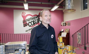 Olivier Berthe, président des "Restos du Coeur", dans des locaux de l'association à Paris le 24 novembre 2014