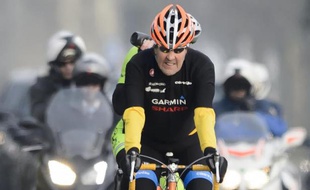 Le secrétaire d'Etat John Kerry lors d'une promenade à vélo le 16 mars 2015 à Lausanne, pendant une pause dans les discussions sur le nucléaire iranien