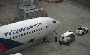 Un avion de la Malaysia Airlines, à l'aéroport international de Kuala Lumpur le 13 mars 2014