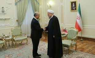 Le chef de l'Agence internationale de l'énergie atomique (AIEA), Yukiya Amano, et le président iranien, Hassan Rohani à Téhéran ole 18 janvier 2016
