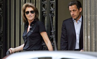 (FILES) In this file photo taken on April 22, 2007 then French right-wing UMP presidential candidate Nicolas Sarkozy (R) leaves his home with his wife Cecilia after casting his ballot at the Ile-de-la-Jatte in Neuilly-sur-Seine, near Paris. - Cecilia Attias, former wife of former president Nicolas Sarkozy, was employed part-time in 2002-2003 at the Assembly as a parliamentary assistant to the deputy of her husband, AFP learned on January 13, 2021 from Sarkozy's entourage, confirming information from Le Canard Encha�ne. (Photo by Thomas COEX / AFP)