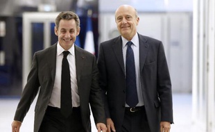 Nicolas Sarkozy au côté d'Alain Juppé le 3 décembre 2014 au siège de l'UMP à Paris