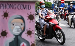 Une femme sur une moto à Hanoï au Vietnam.