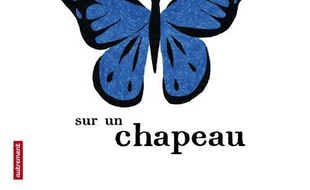 Un papillon sur un chapeau