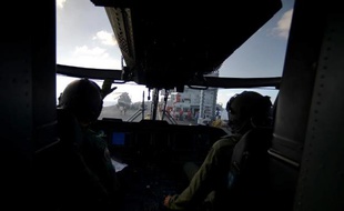 Salle de contrôle d'un navire italien faisant partie du dispositif Mare Nostrum qui surveille d'éventuels naufrages de bateaux en Méditerranée