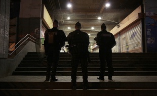 French policemen stand guard at the Rose des Vents district also known as the Cite des 3000 (City of 3000) in Aulnay-sous-Bois, northeast of Paris on February 7, 2017. Angry French youths clashed with police and burned cars in a Paris suburb for a third night in a row on February 6, 2017 police sources said, amid simmering anger over the alleged rape of a local man during his arrest last week. A 22-year-old black youth worker named as Theo required major surgery after his arrest on February 2, 2017 when he claims a police officer sodomize