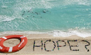 Des militants de Greenpeace lors du sommet de Cancun sur le climat, le 10 décembre 2010.