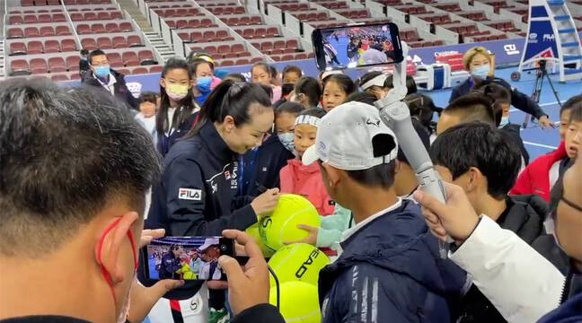 Tennis player Peng Shuai reappears at a public event in Beijing