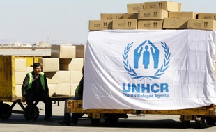 Un employé du Haut-Commissariat de l'ONU pour les réfugiés, le 13 février 2014 à Damas