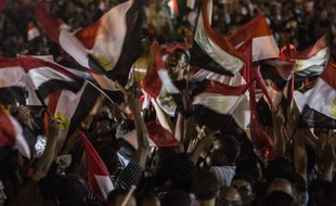 Les Egyptiens célèbrent le 3 juin 2014 sur la place Tahir au Caire, la victoire à l'élection présidentielle de l'ancien ministre de la défense et chef de l'armée, le général Abdel Fattah al-Sissi