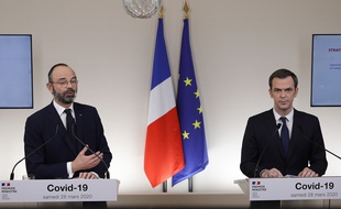 Le Premier ministre Edouard Philippe et le ministre de la Santé Olivier Véran, lors d'une conférence de presse, le 28 mars 2020.