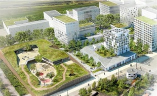 Vue, depuis le site des chantiers, sur l'école primaire et les immeubles.