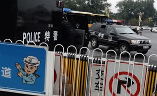 Des policiers en surveillance place Tiananmen à Pékin le 22 juin 2013