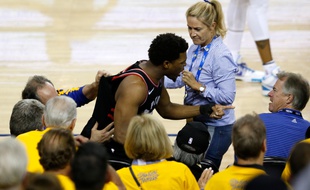 Le meneur de Toronto, Kyle Lowry, a été poussé par un actionnaire de Golden State, Mark Stevens (droite), le 5 juin 2019.
