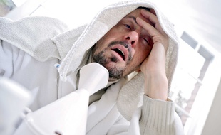 Illustration d'une personne malade souffrant de maux de tête.
