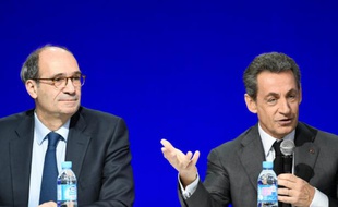 Eric Woerth et Nicolas Sarkozy au conseil national du parti Les Républicains le 13 février 2016 à Paris
