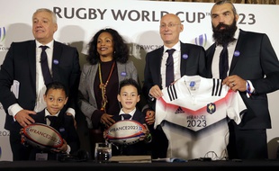 Top row from left, Director of the French 2023 World Cup bid Claude Atcher, Minister of Sport Laura Flessel, President of the French Rugby Union Bernard Laporte and France2023 leader and bid abassador Sebastian Chabal, pose with two children of late rugby legend Jonah Tali Lomu, Dhyreille Lomu, right, and Brayley Lomu, after presenting their bid for the 2023 Rugby World Cup in London, Monday, Sept. 25, 2017. South Africa, Ireland and France will bid for the rights to hold the RWC in 2023, following the next RWC which will be held in Japan in 2019.