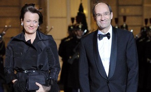 Eric Woerth, alors ministre du Budget, et son épouse Florence, au Palais de l'Elysée le 2 mars 2010.