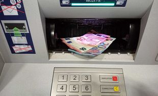 Un distributeur automatique de billets (Illustration).