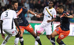 Olivier Giroud et Younès Belhanda lors d'un match contre Sochaux, le 7 avril 2012.