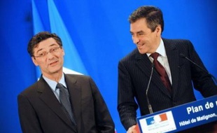 A ses côtés, François Fillon a souligné sa volonté d'aller vite, annonçant que le Parlement serait saisi "début janvier" de deux projets de loi sur la mise en oeuvre du plan.