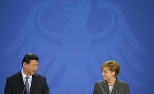 Le président chinois Xi Jinping et la chancelière allemande Angela Merkel, lors du conférence d epresse à Berlin le 28 mars 2014