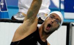 France's David Smetanine reacts after winning the men's 100m Freestyle S4 final at the National Aquatics Centre, also known as the Water Cube, in the Beijing 2008 Paralympic Games September 7, 2008. REUTERS/David Gray (CHINA)