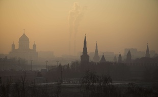 The Moscow Kremlin, left, and the Christ the Saviour Cathedral are seen through the evening haze in Moscow, Russia, Thursday, Nov. 20, 2014. Evening temperatures plunged to -10 degrees Celsius (14 Fahrenheit) in Moscow. (AP Photo/Alexander Zemlianichenko Jr)/XAZ124/7534892400/1411202155