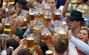 People celebrate the opening of the 182. Oktoberfest beer festival in Munich, southern Germany, Saturday, Sept. 19, 2015. The world's largest beer festival will be held from Sept. 19 to Oct. 4, 2015. (AP Photo/Matthias Schrader)/MAS127/223923640376/1509192133