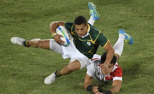 Le Sud-Africain Cheslin Kolbe face au Japon lors du match de rugby à VII pour la médaille de bronze aux Jeux Olympiques de Rio, le 11 août 2016.