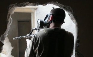 Capture d'écran d'une vidéo du Monde.fr montrant des combattants rebelles en Syrie, au printemps 2013.