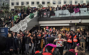 Extinction Rebellion climate activists protest at the shopping center "Italie 2", in Paris, France, Saturday, Oct. 5, 2019.