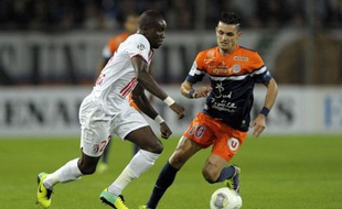 Le Lillois Pape Souaré face au Montpelliérain Rémi Cabella en octobre 2013 au stade de La Mosson.