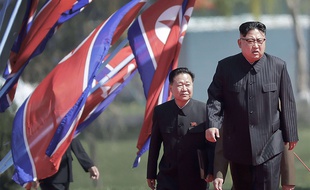 North Korean leader Kim Jong Un, right, arrives for the official opening of the Ryomyong residential area, a collection of more than a dozen apartment buildings, Thursday, April 13, 2017, in Pyongyang, North Korea.