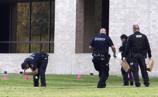 Police collect evidence after a shooting happened on Lone Star College North Harris campus on Tuesday January 22, in Houston. The shooting at a community college wounded three people Tuesday and sent some students fleeing for safety while others with medical training helped tend the wounded